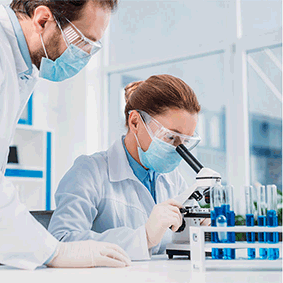 Man and woman at microscope.